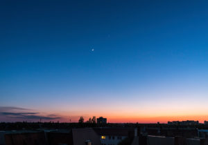 Crescent moon and Venus at dusk in the western sky over Berlin Crescent moon and Venus at dusk in the western sky over Berlin
